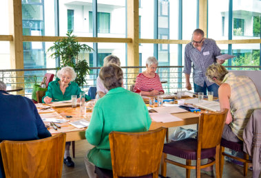 elderly people enjoy playing board games