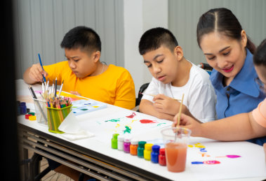 kids and teacher painting