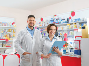 Portrait of professional pharmacists in modern drugstore