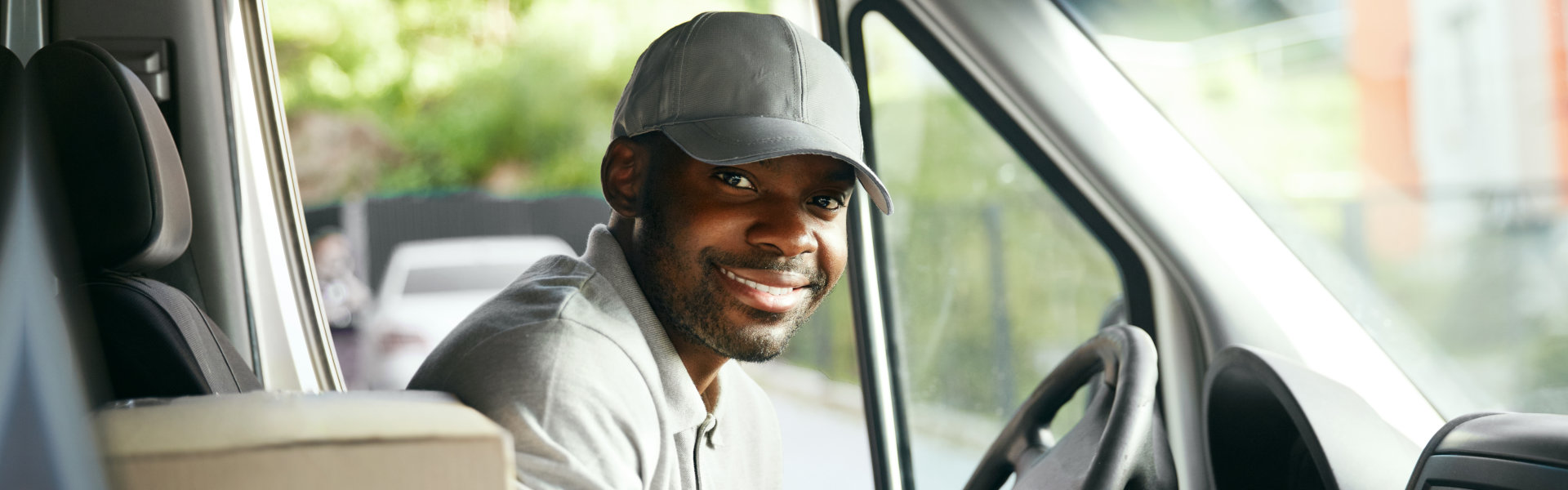 Man Driver Driving Delivery Car With Boxes And Packages